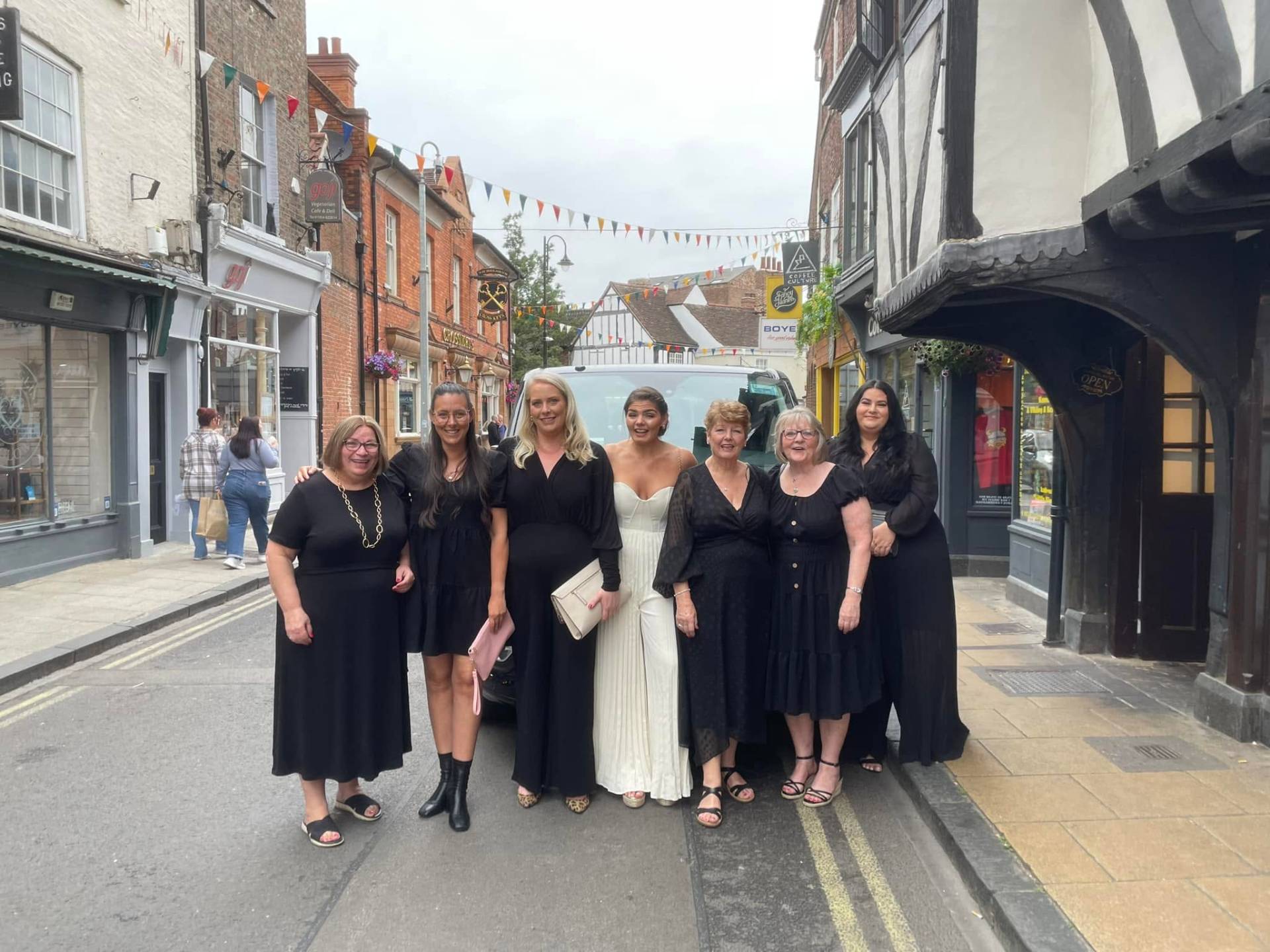 A group dressed up for a night out in York with the van behind